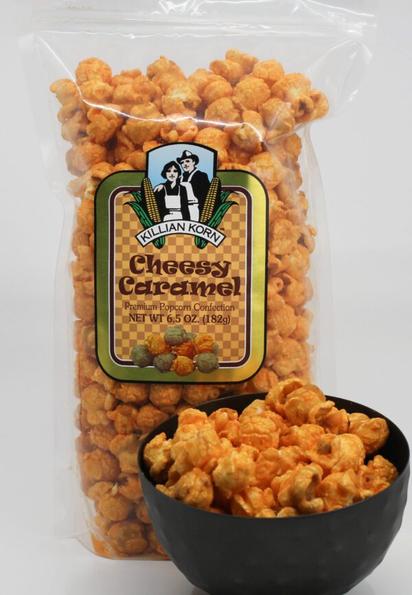 Cheesy Caramel Popcorn in a black bowl and packet